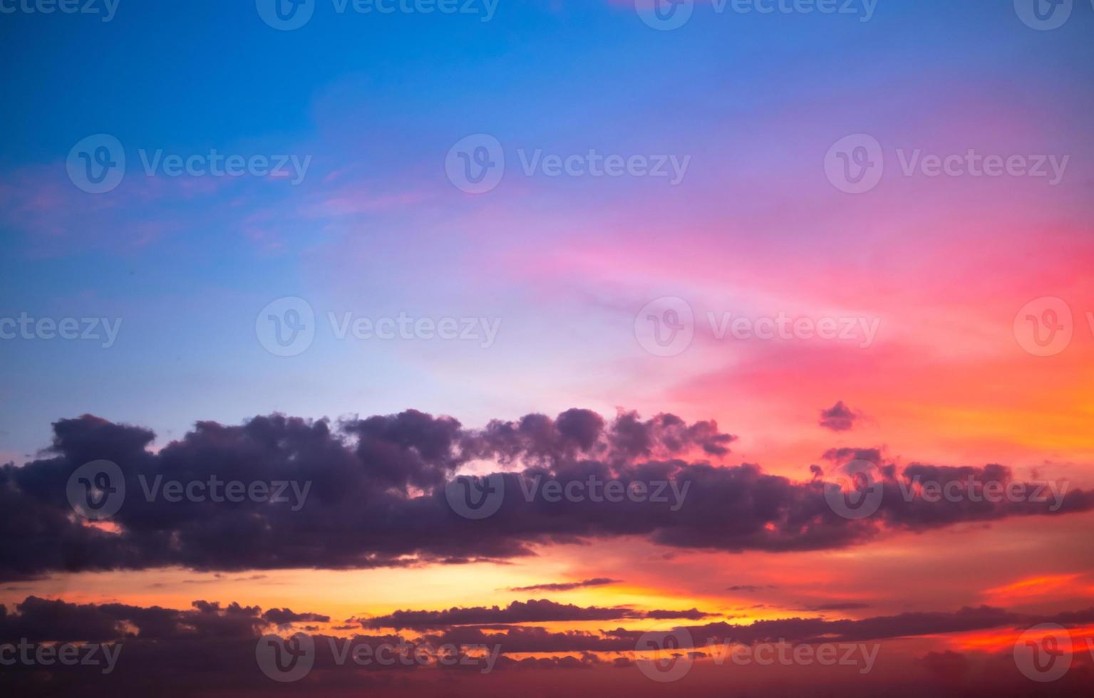 beautiful gradient orange and ranibow colour clouds and sunlight on the blue sky perfect for the background, take in everning,Twilight photo