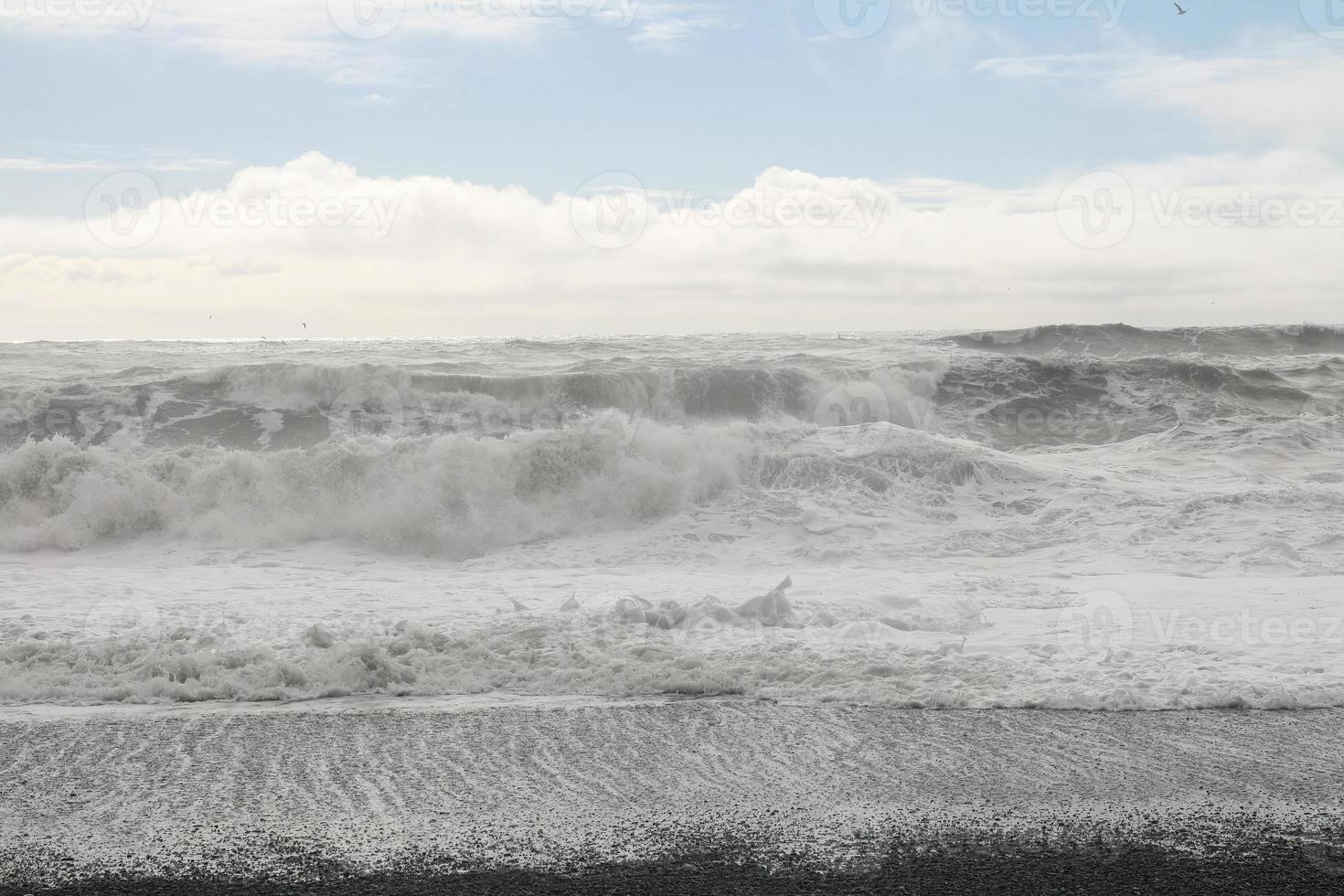 Huge white waves in cold north ocean in Iceland 5 photo