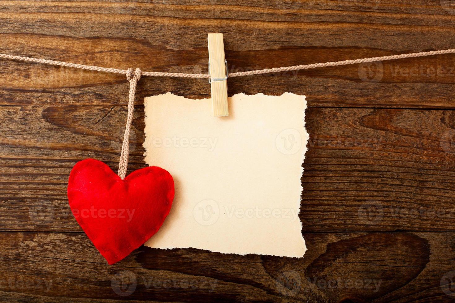 Valentines Vintage Handmade Hearts over Wooden Background. photo