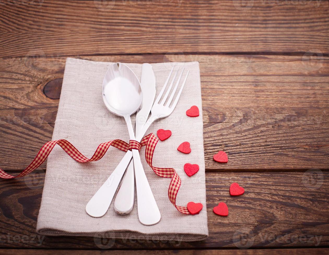 Valentines dinner on wooden background photo