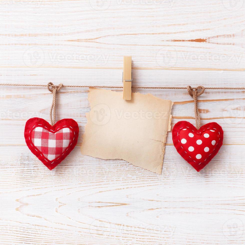 Love hearts on wooden texture background. Valentines day card concept. Heart for Valentines Day Background. photo