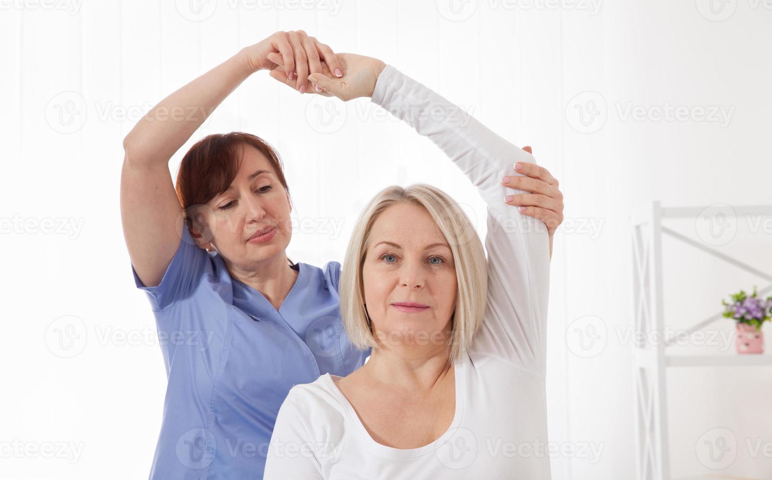Physiotherapy, sport injury rehabilitation treatment. Woman having chiropractic back adjustment. Osteopathy, Alternative medicine, pain relief concept. photo