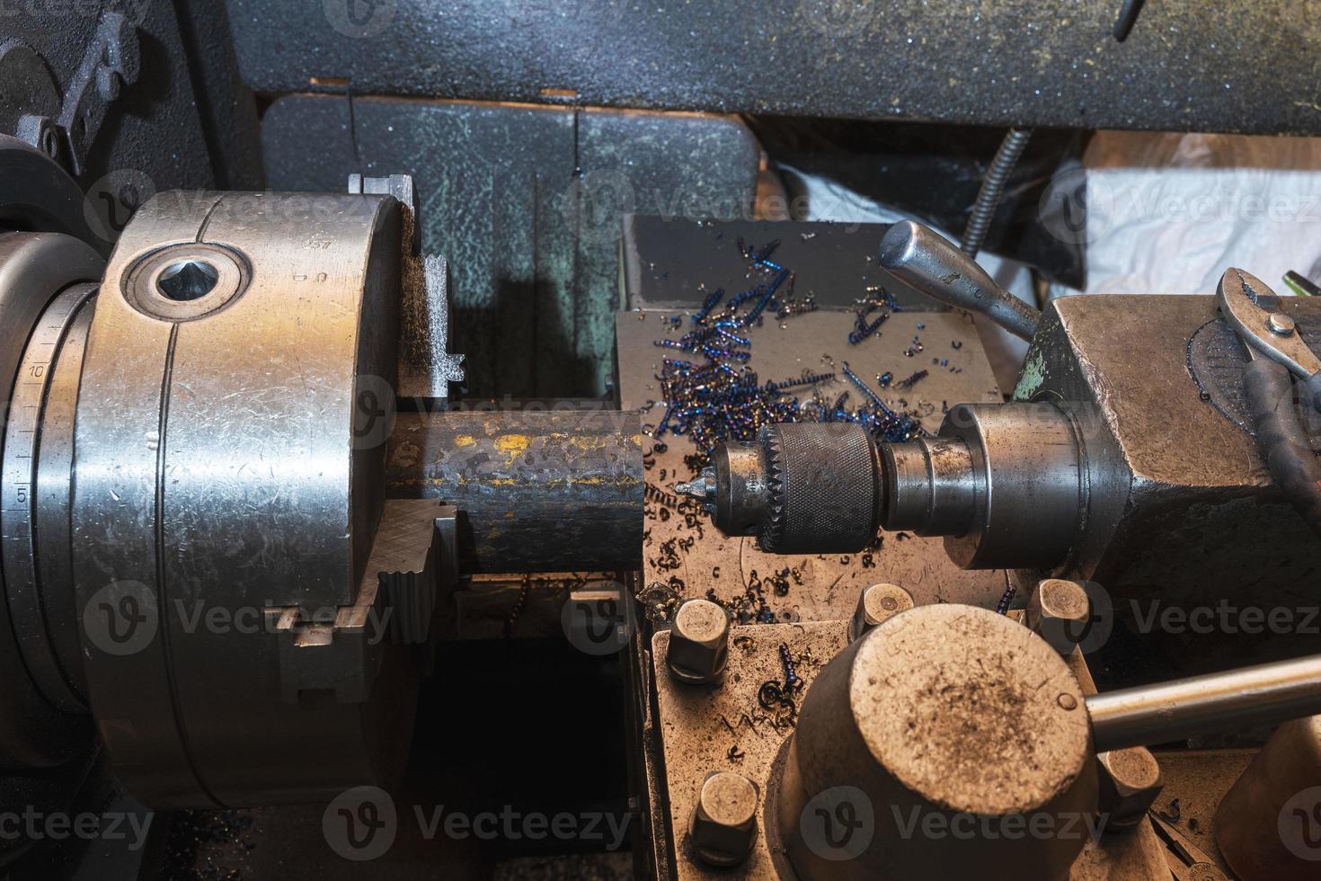 Old metal lathe in the workshop, metalworking, machine tools photo