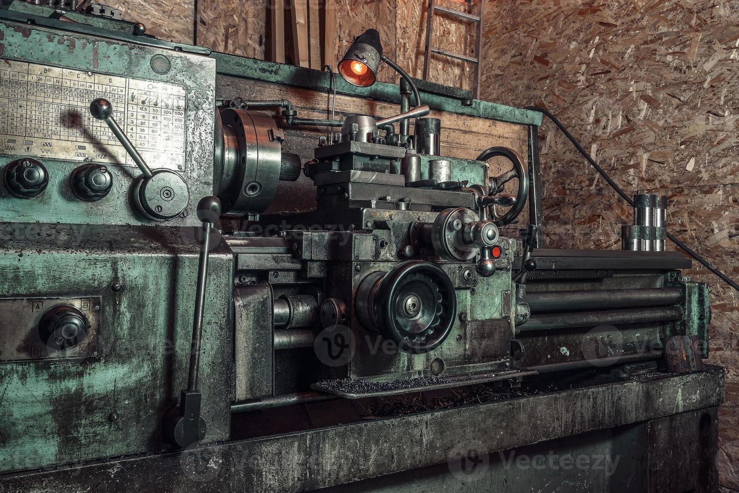 Old metal lathe in the workshop, metalworking, machine tools photo