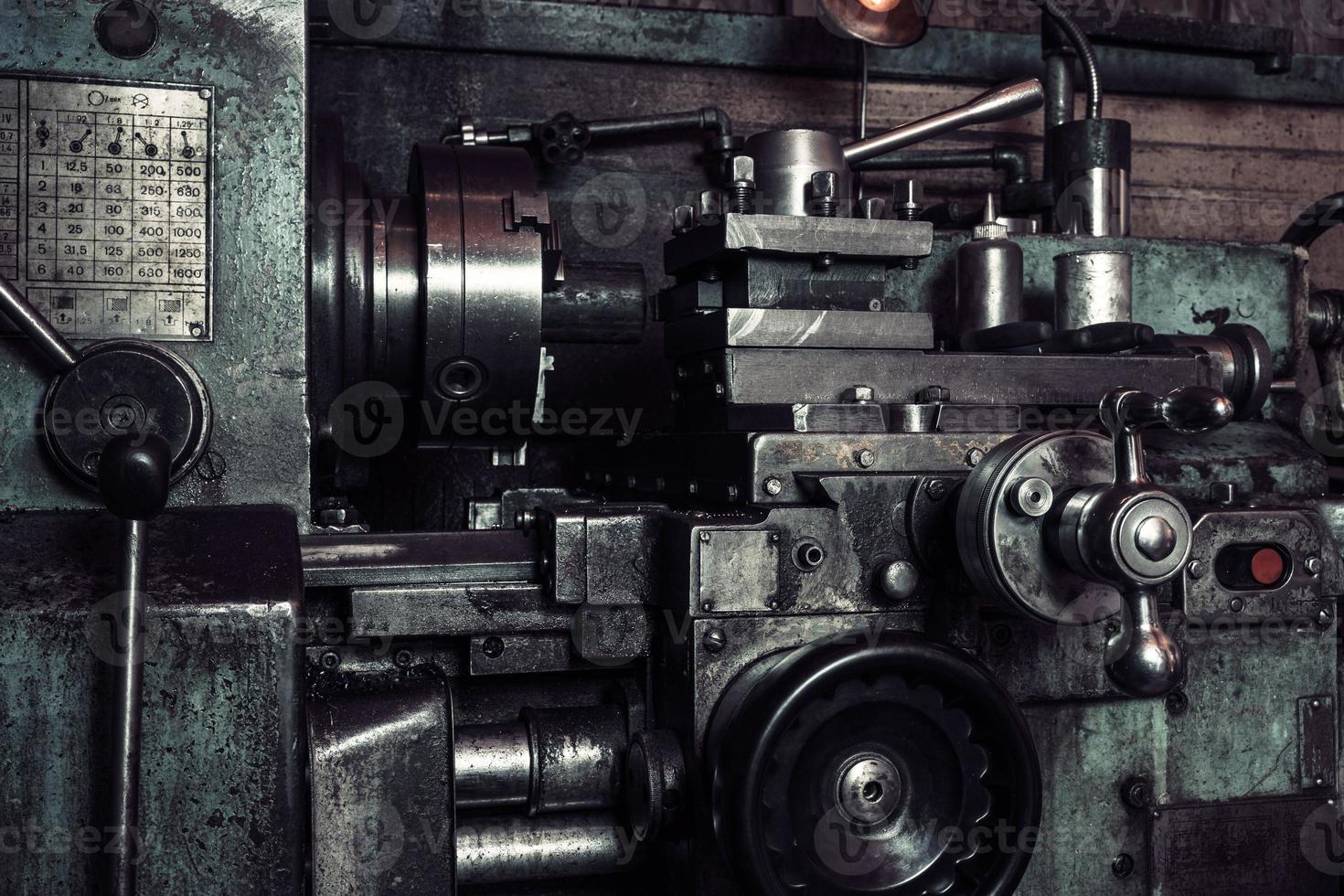 Old metal lathe in the workshop, metalworking, machine tools photo