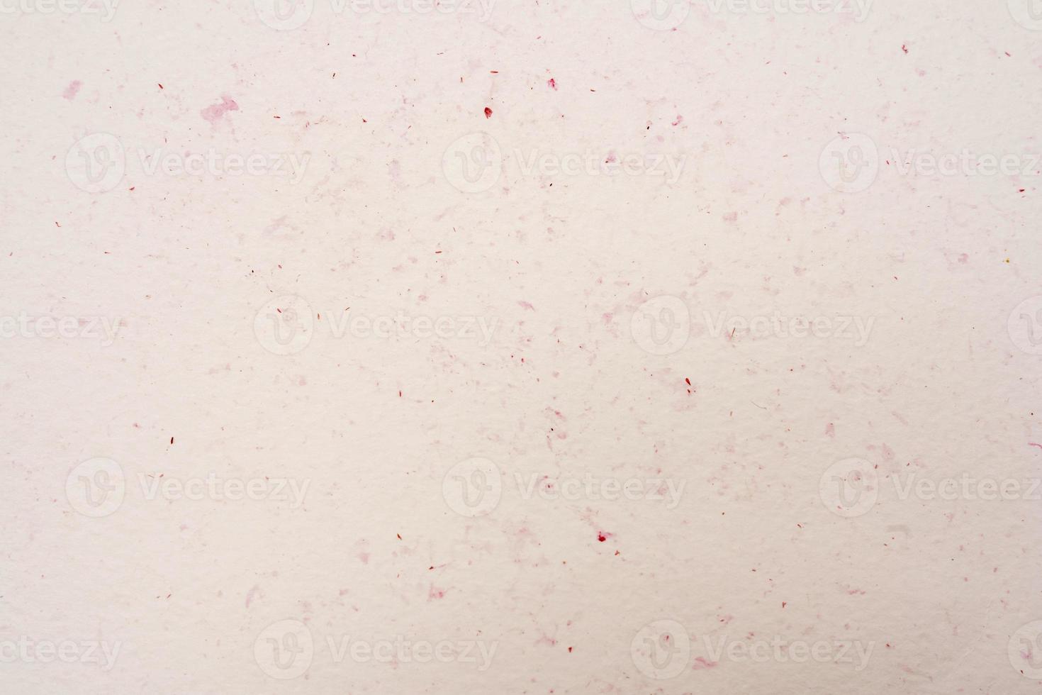 Laconic beige background with red flecks, cream background photo