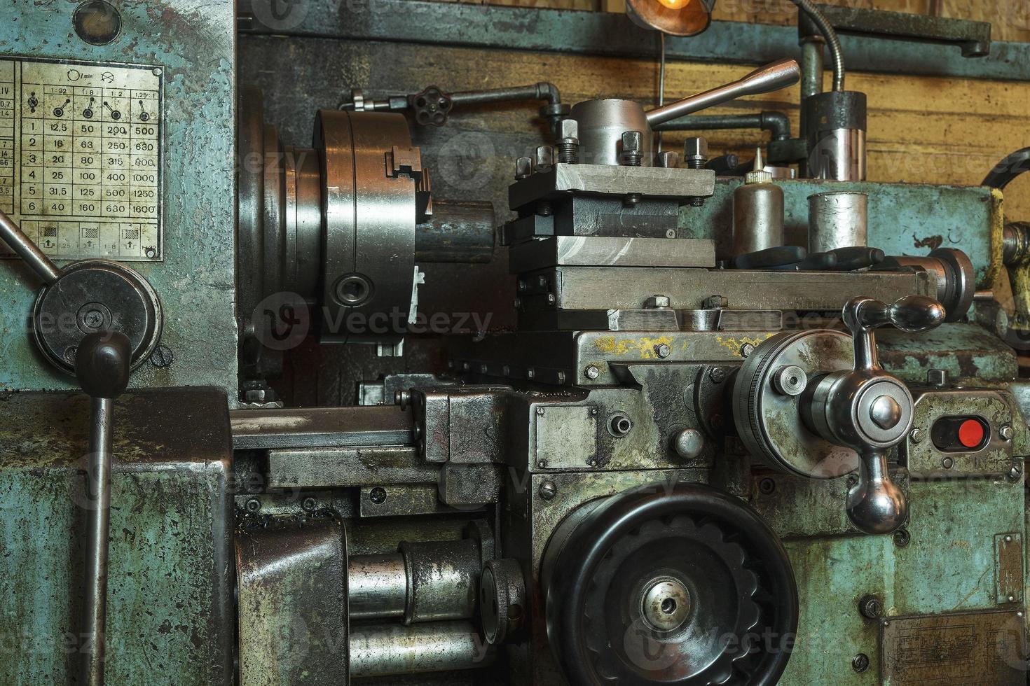 Old metal lathe in the workshop, metalworking, machine tools photo