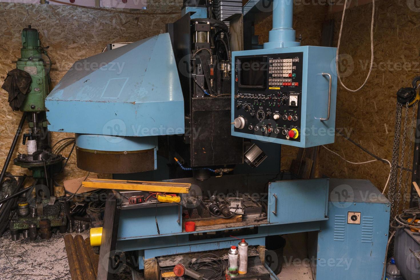 An old CNC machine, an industrial milling tool in the workshop photo