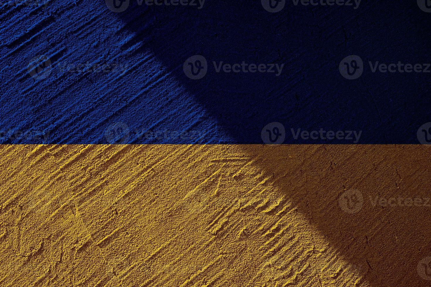 Ukrainian state national flag. Texture concrete grunge wall in yellow-blue color. State symbol of Ukraine and Ukrainians. Ukrainian flag on a concrete wall background. photo