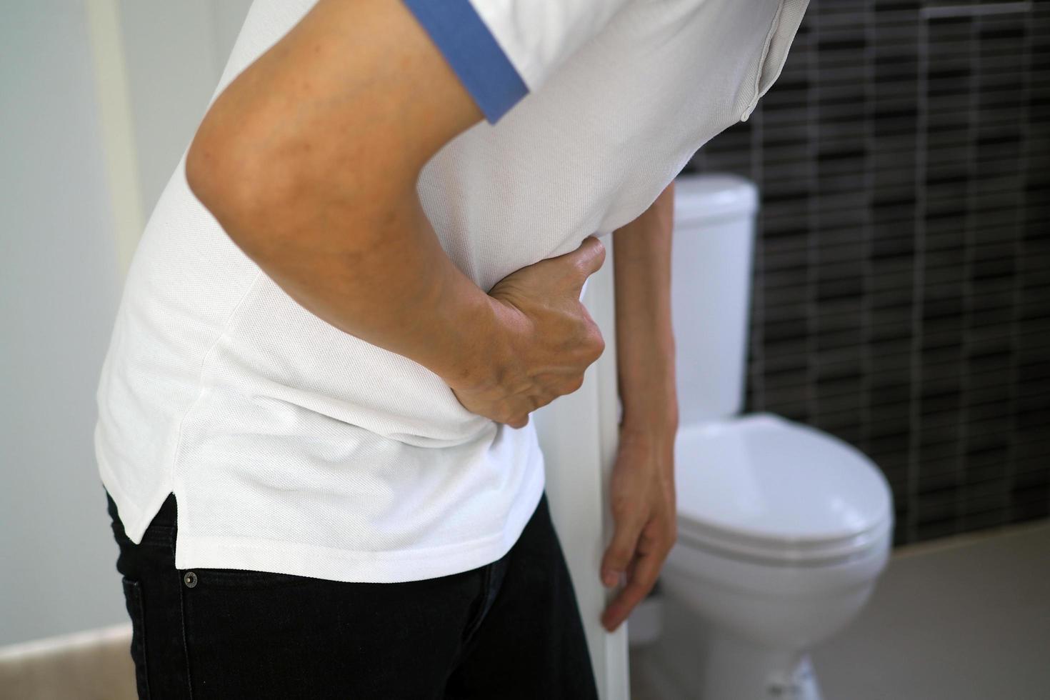 Men have abdominal pain. Want to shit. diarrhea concept photo