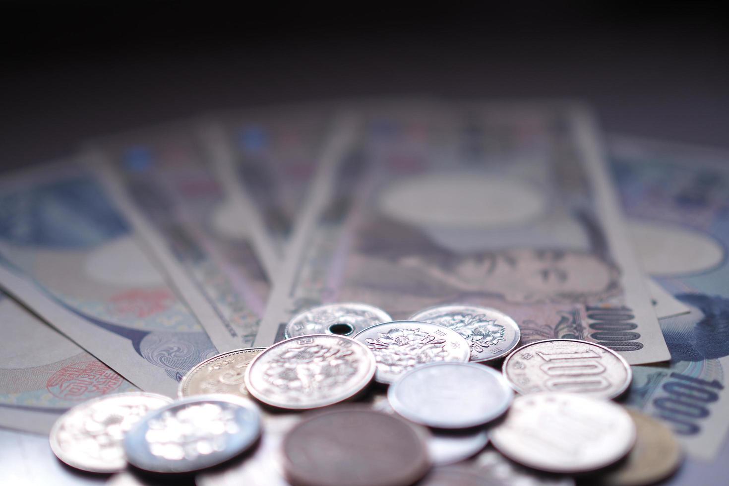 Japanese yen notes and Japanese yen coins for money concept background photo