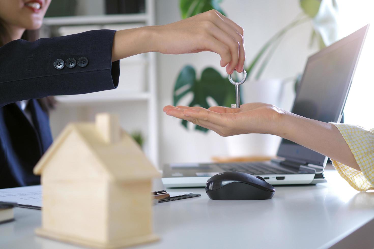 Sellers are sending home keys to buyers. Selling houses, renting houses and buying ideas photo