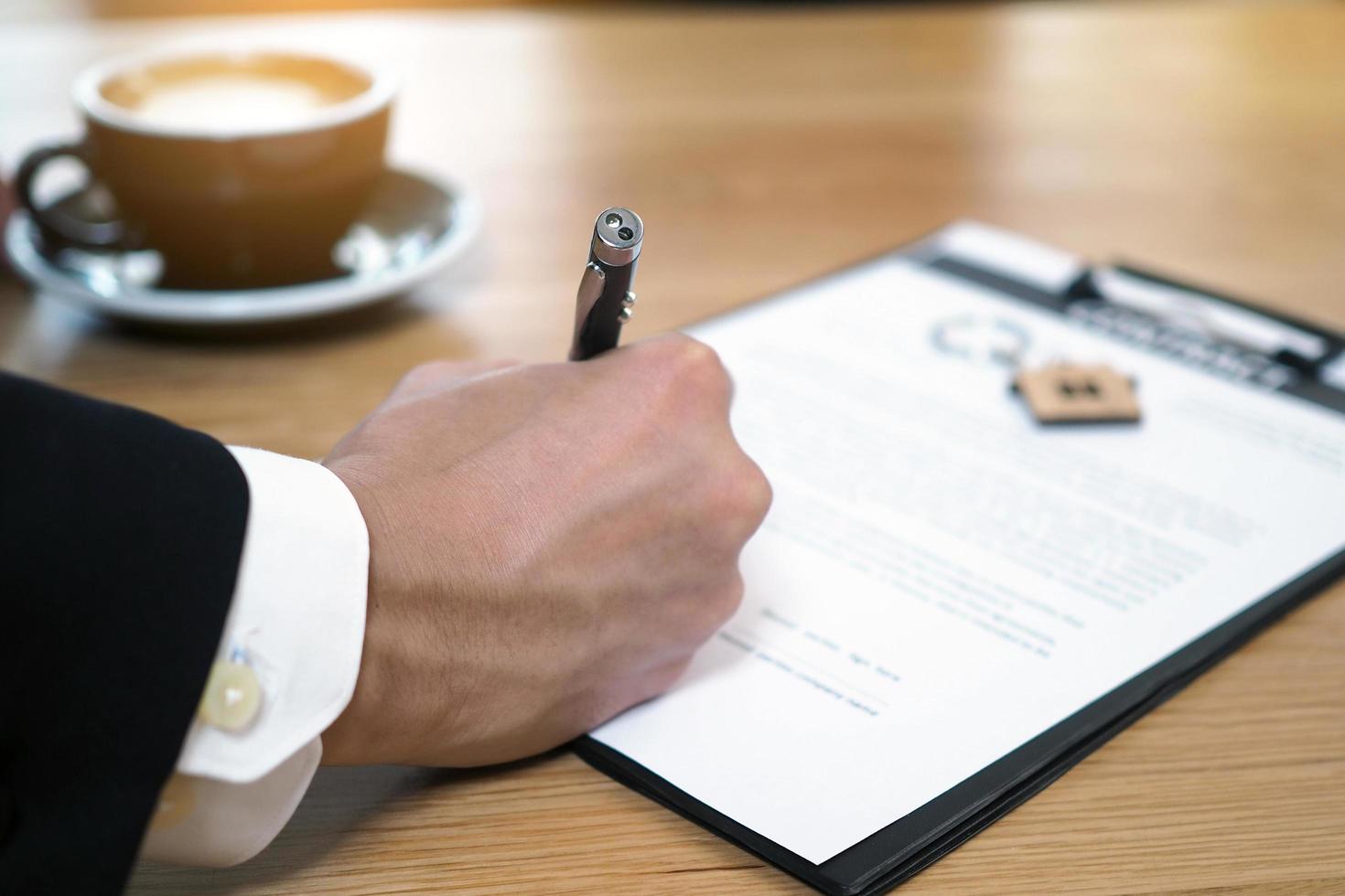 Businessmen sign contracts for investment in construction and housing projects, contract documents that have legal consequences. Buying, selling and renting concept photo