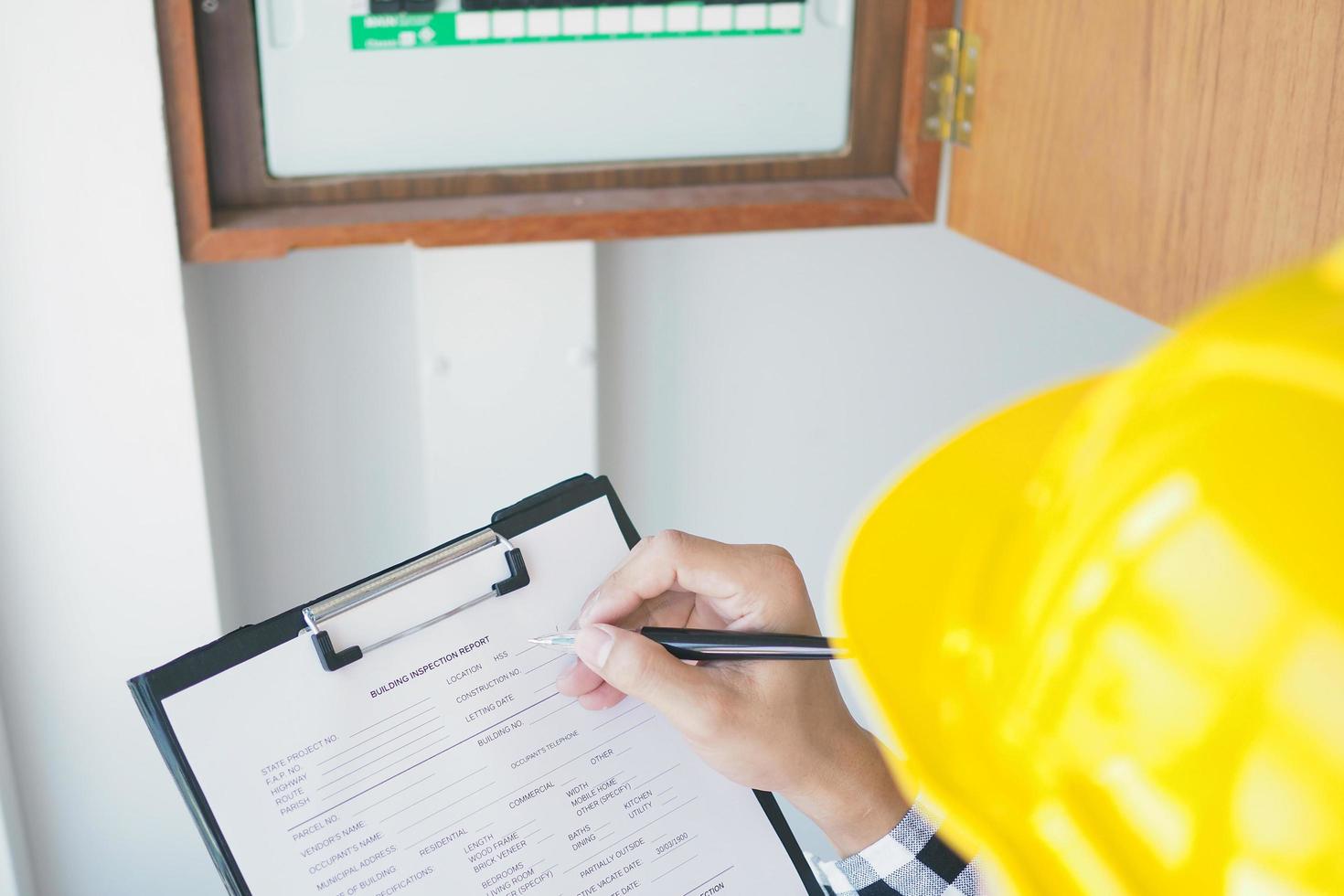 Inspectors are inspecting the home lighting cabinet. photo