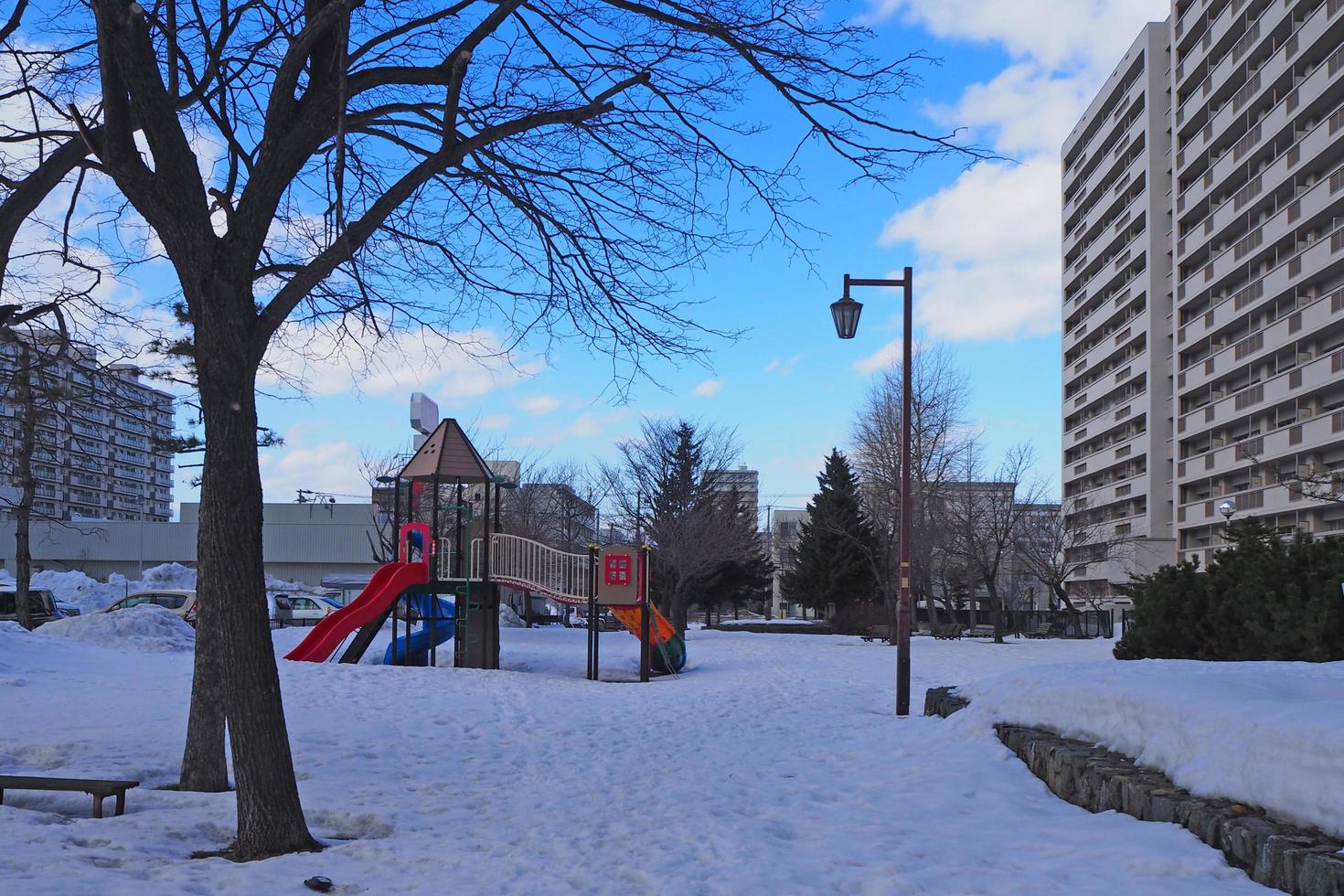 Children's playground in winter on a snow-covered floor. photo