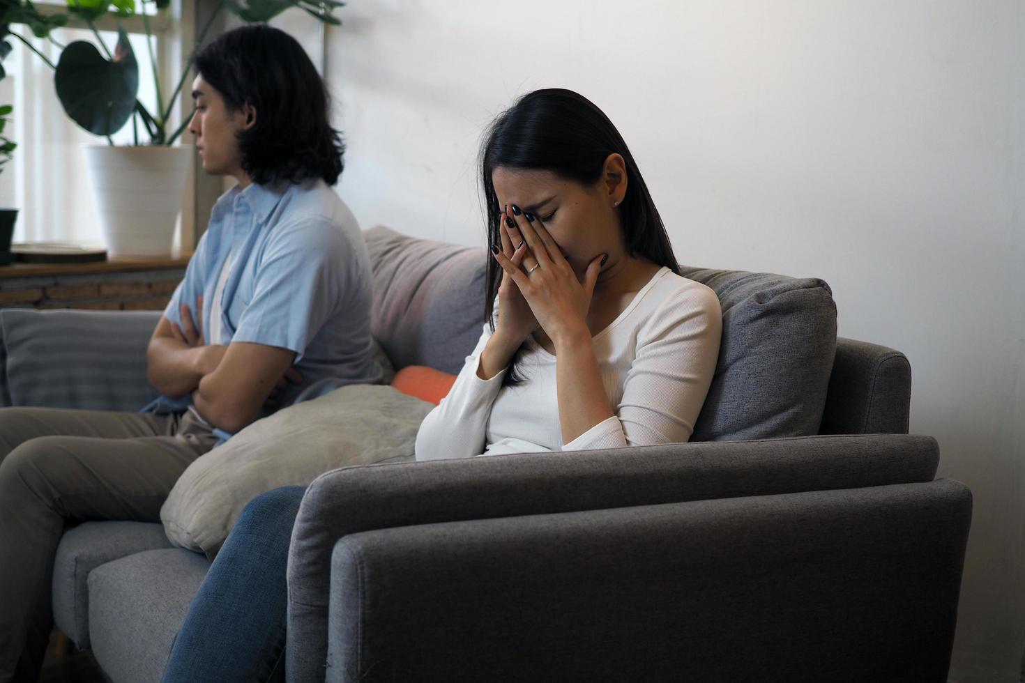 Couples fight Sit facing each other side. Beginning the end of the relationship of husband and wife in adolescence photo