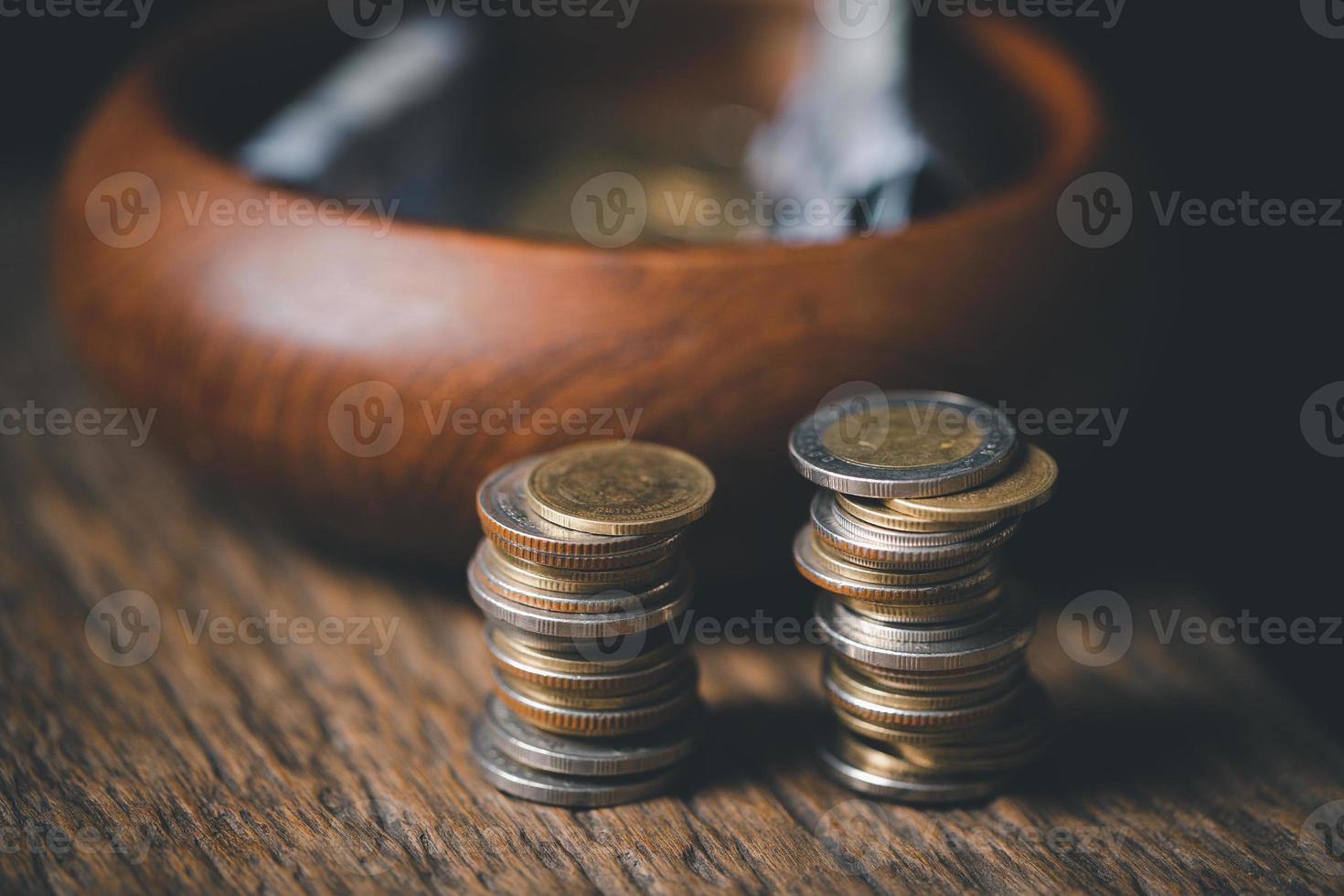 One tenth or tithe is basis on which Bible teaches us to give one tenth of first fruit to God. coins with Holy Bible. Biblical concept of Christian offering, generosity, and giving tithes in church. photo