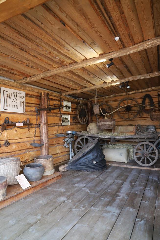 Tetyushi, Tatarstan.Russia. May 02, 2022. Museum of fishing history.View of a  traditional russian peasant barn with farm equipment. photo