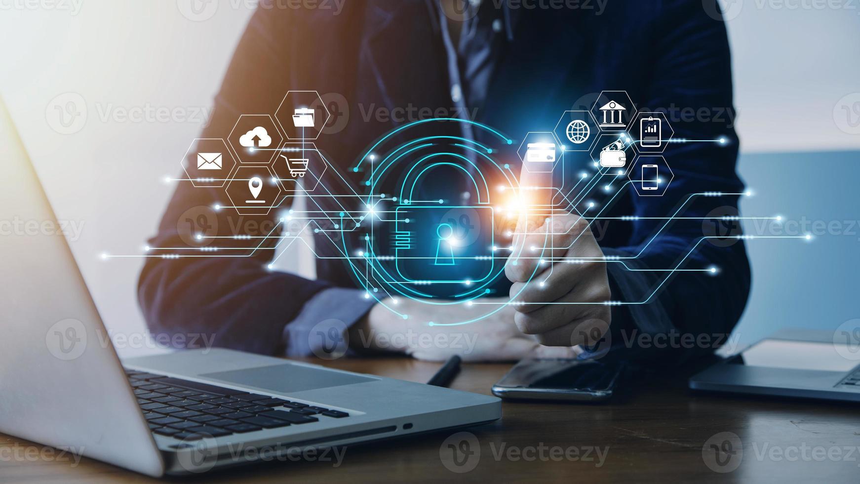 Cybersecurity and privacy concepts to protect data. Lock icon and internet network security technology. Businessman protecting personal data on smart phone with virtual screen interfaces. photo