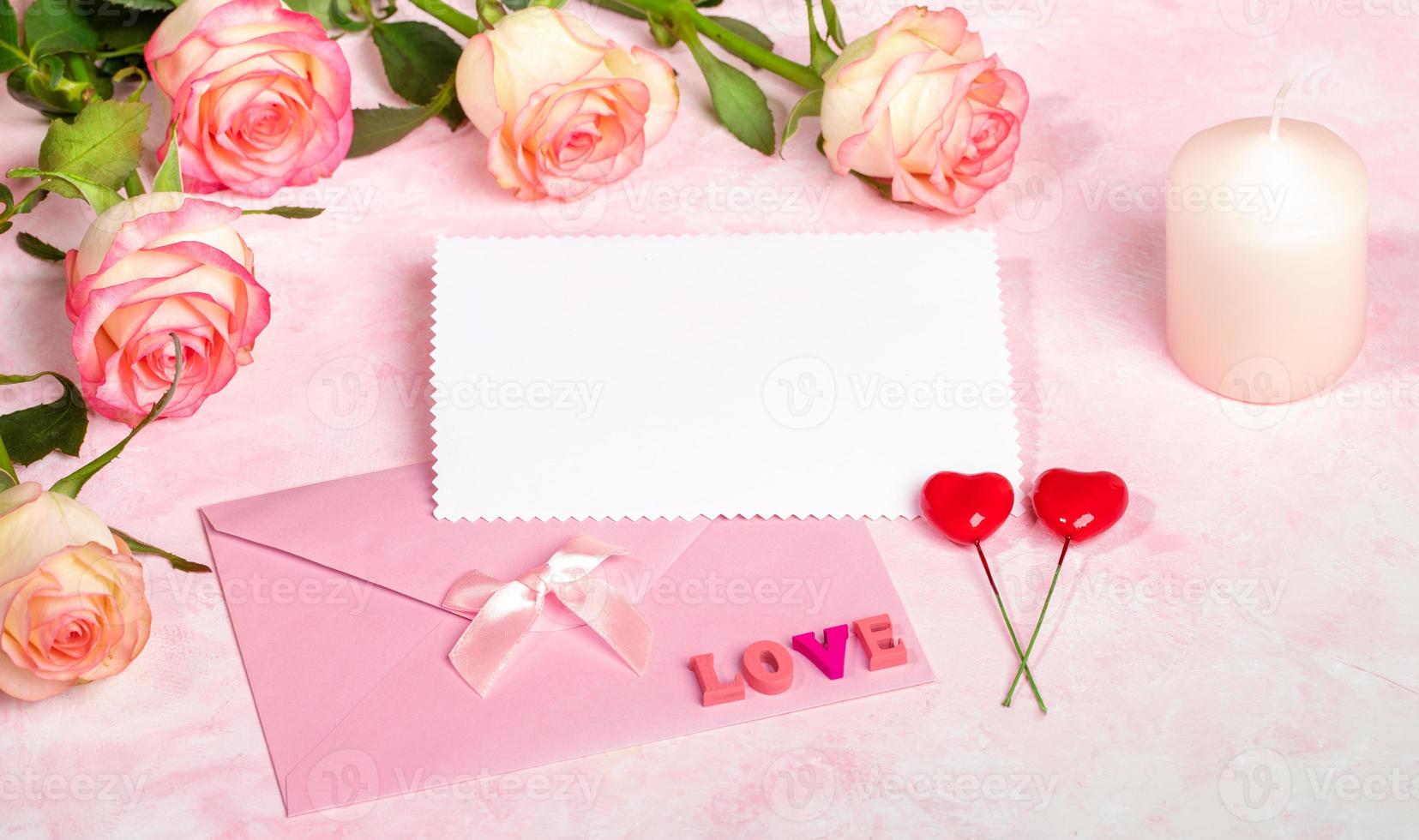 Festive mock up with roses, envelope, empty blank sheet, candle, hearts, letters LOVE. Copy space. photo