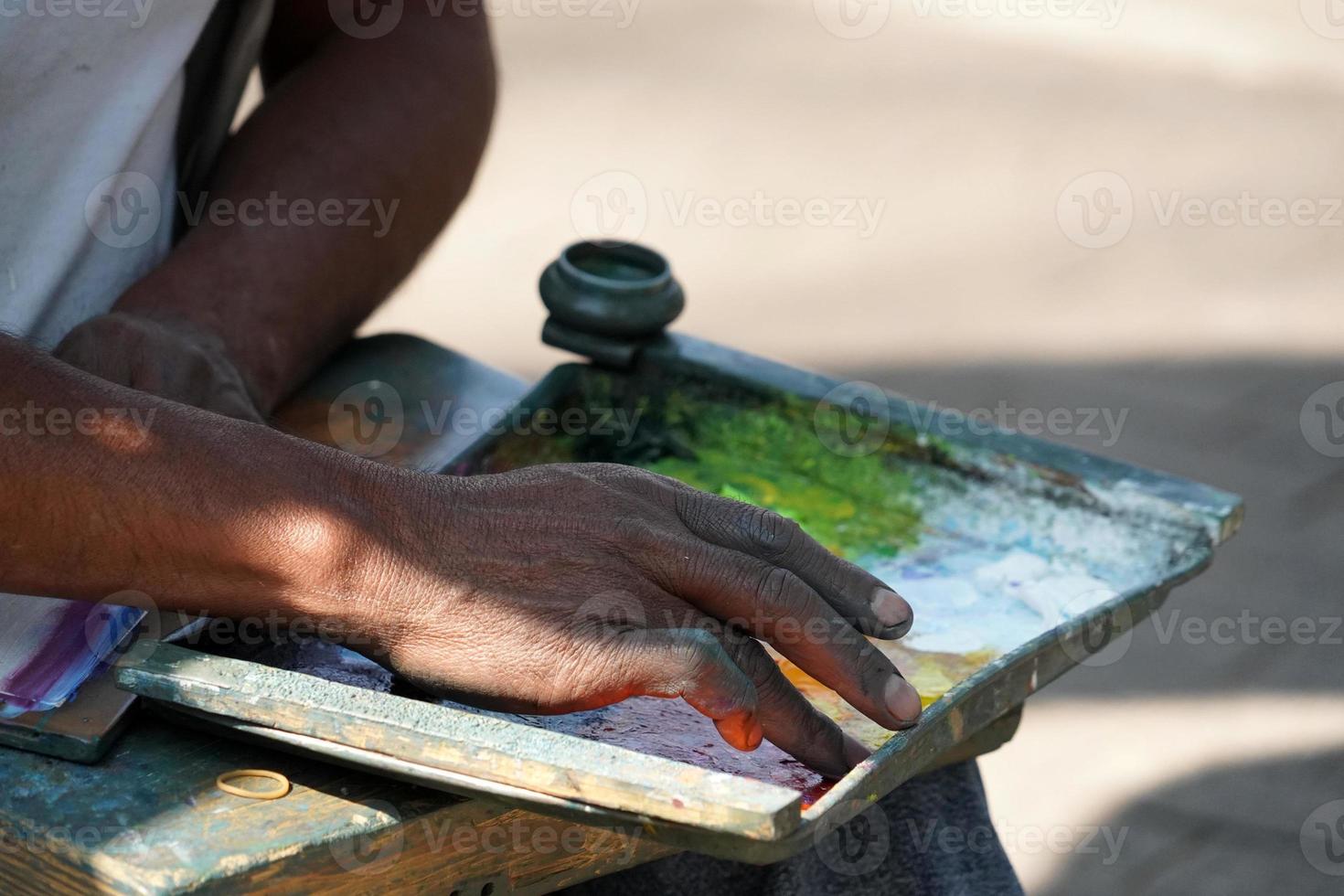 Man painting with hand photo