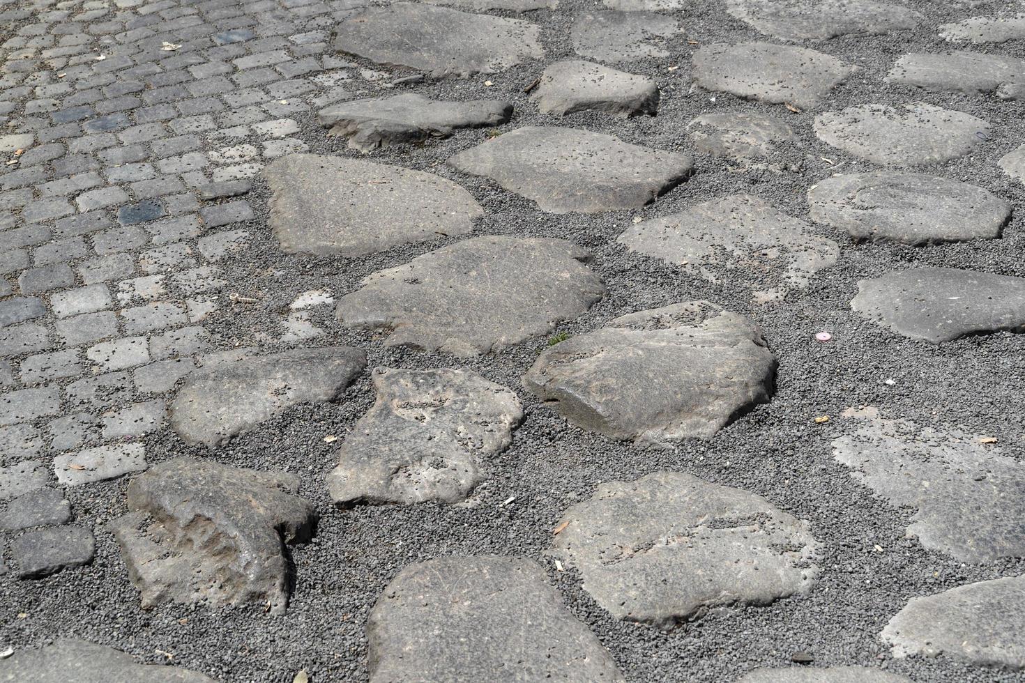 old stone roman road in rome photo