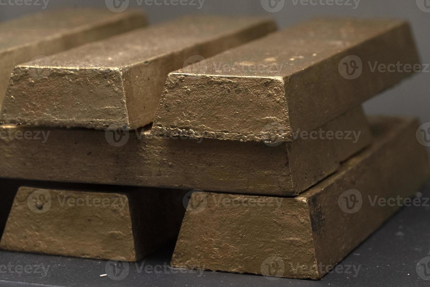 Golden ingots inside bank safe photo