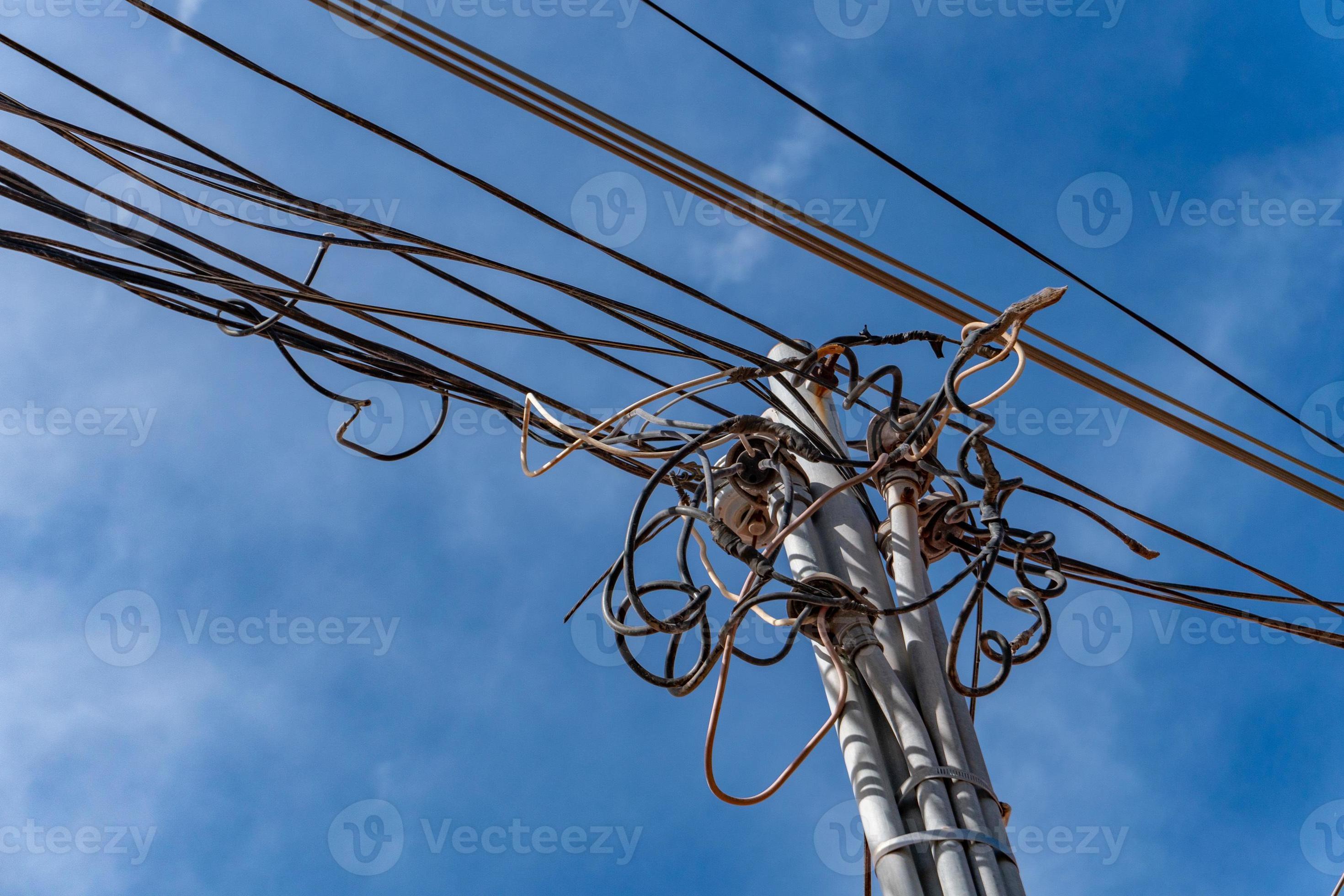 Electric cables tangle on wood post 18804811 Stock Photo at Vecteezy