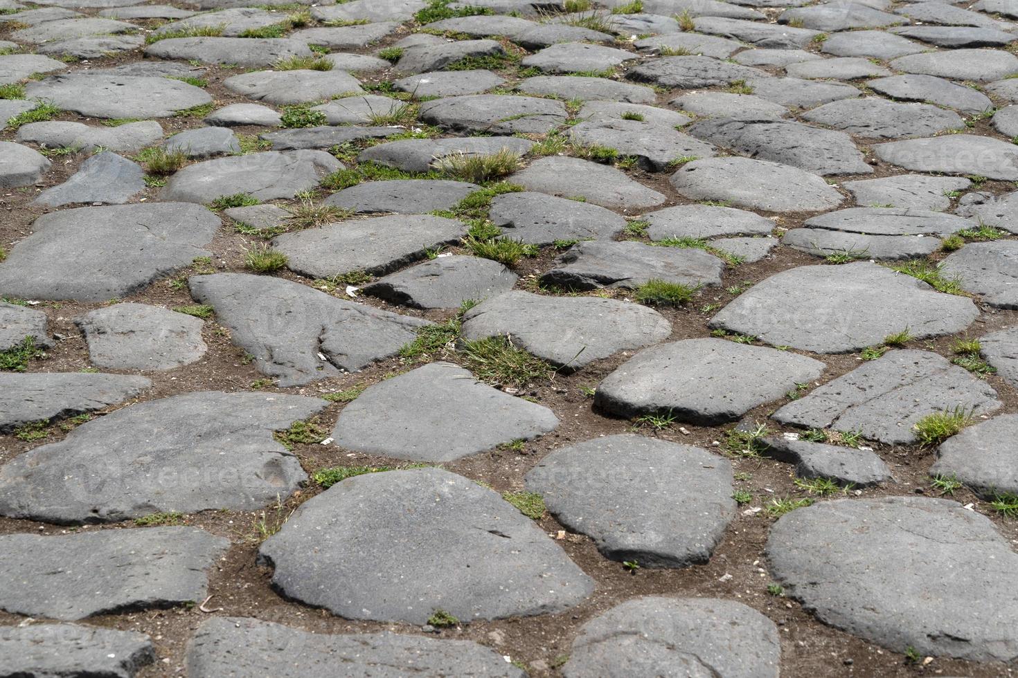 old stone roman road in rome photo