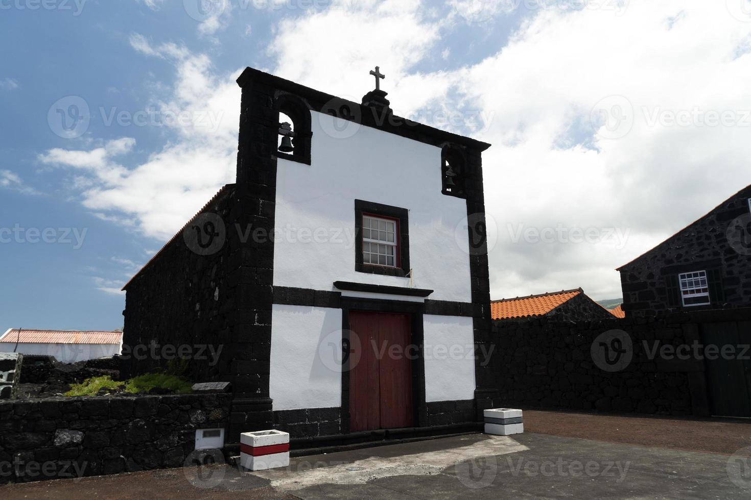 Lajido village Pico Island Azores black lava houses red windows photo