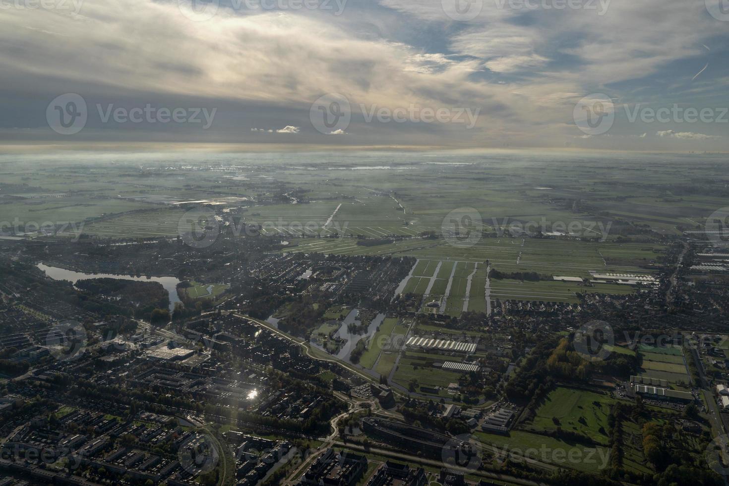 fog and clouds amsterdam area aerial view photo