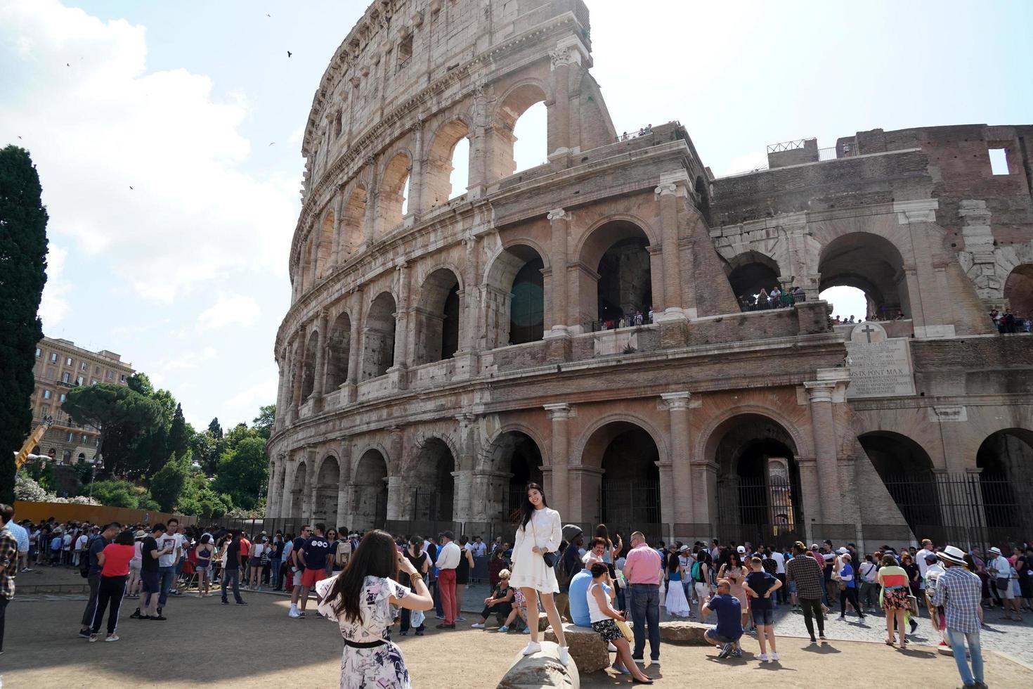 ROME, ITALY - JUNE 10 2018 -  Tourists taking pictures and selfies at colosseo photo