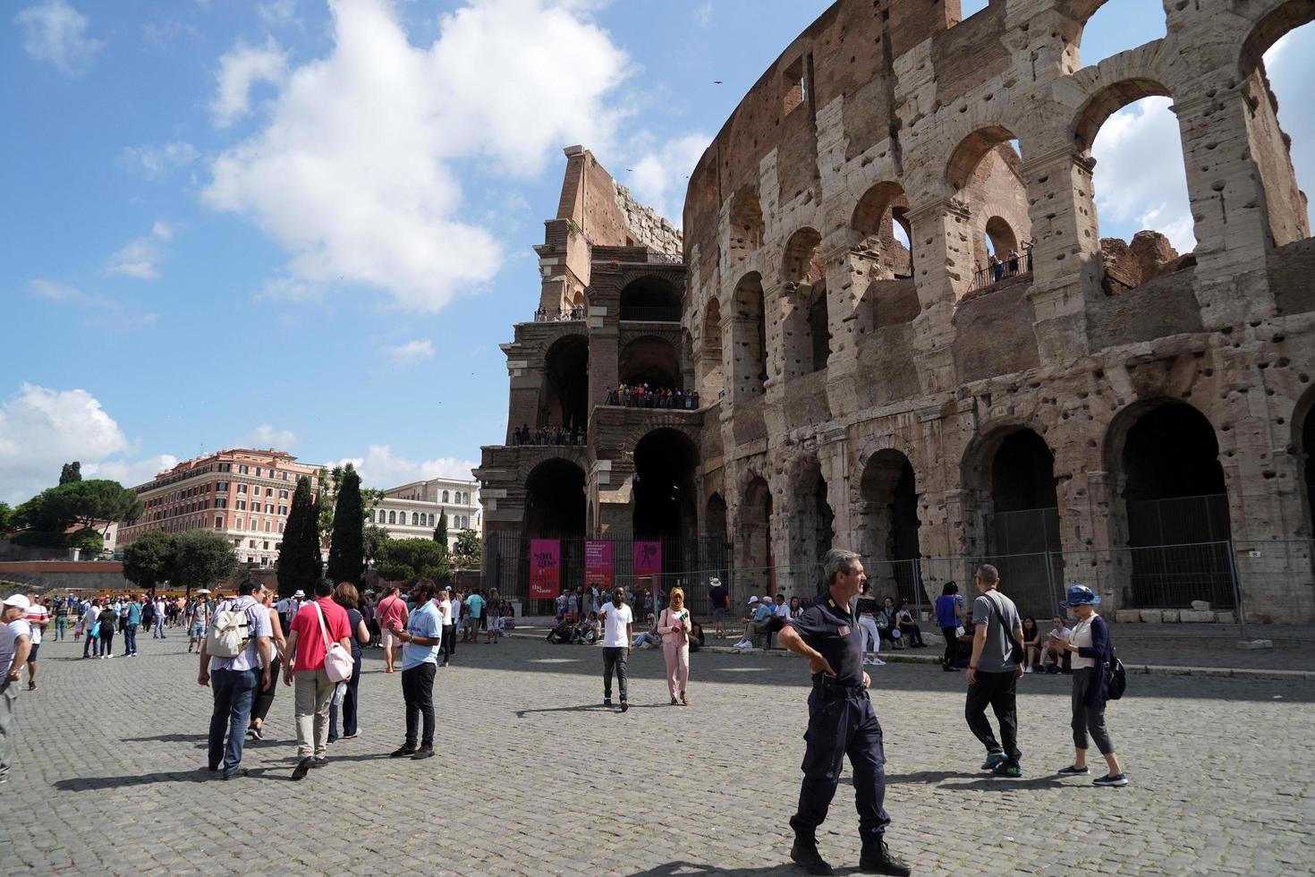 ROME, ITALY - JUNE 10 2018 -  Tourists taking pictures and selfies at colosseo photo