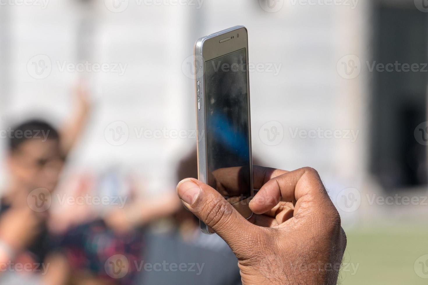 hand taking selfie picture with smartphone photo