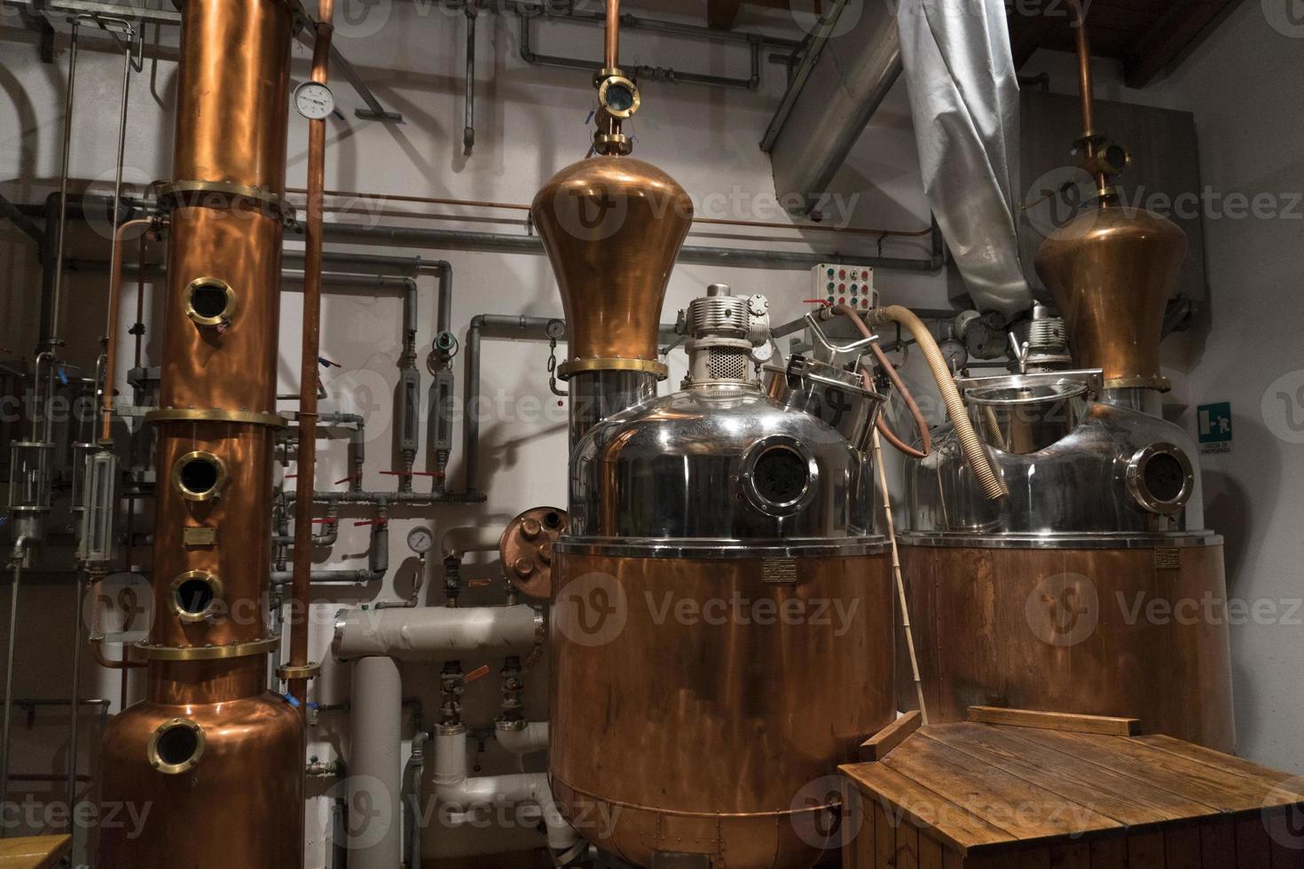 Copper still alembic inside distillery photo