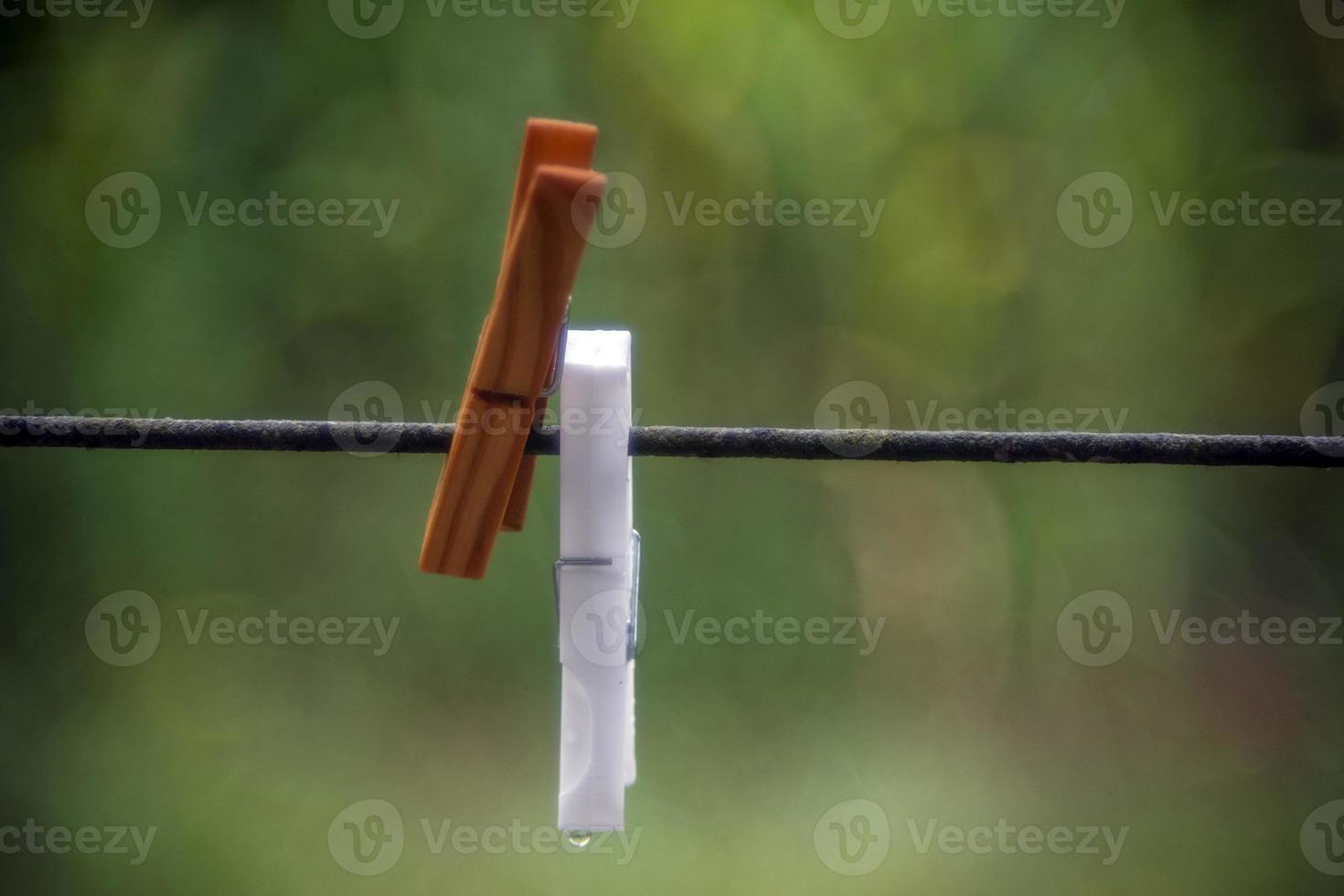 clothespin detail isolated on bubble green bokeh photo