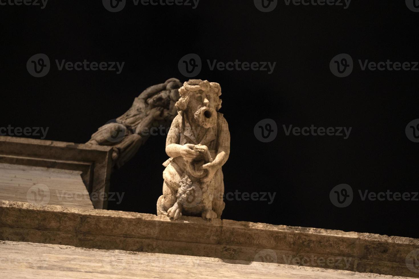 Valencia Silk Exchange Market building Lonja de la Seda gargoyles at night photo