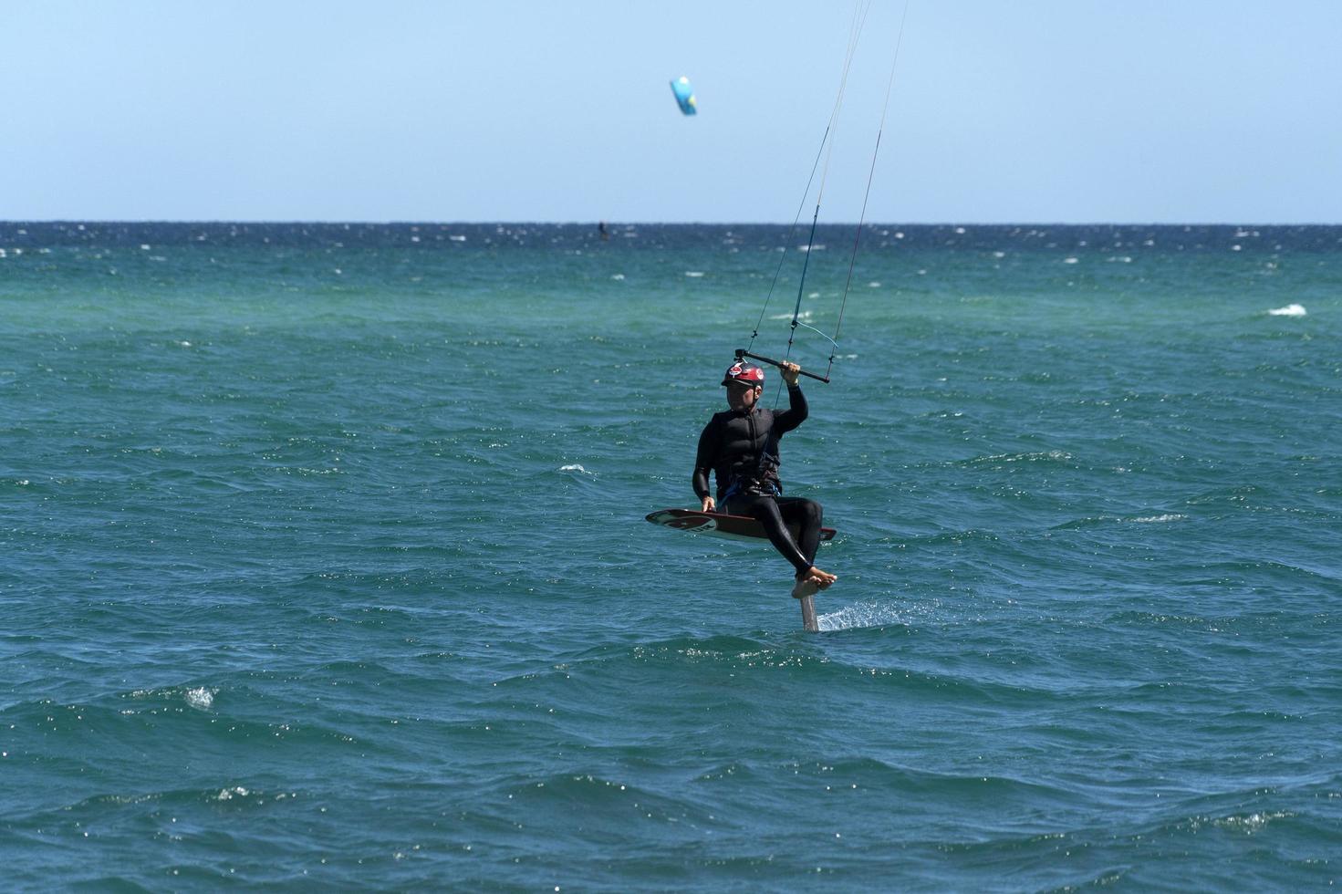 LA VENTANA, MEXICO - FEBRUARY 16 2020 - kite surfering on the windy beach photo