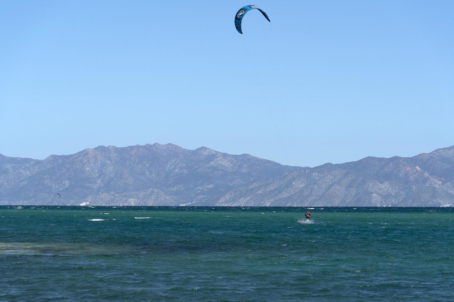 LA VENTANA, MEXICO - FEBRUARY 16 2020 - kite surfering on the windy beach photo
