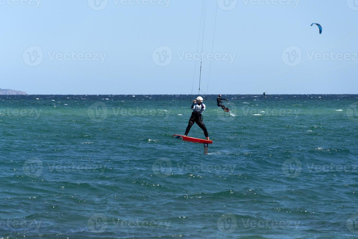 LA VENTANA, MEXICO - FEBRUARY 16 2020 - kite surfering on the windy beach photo