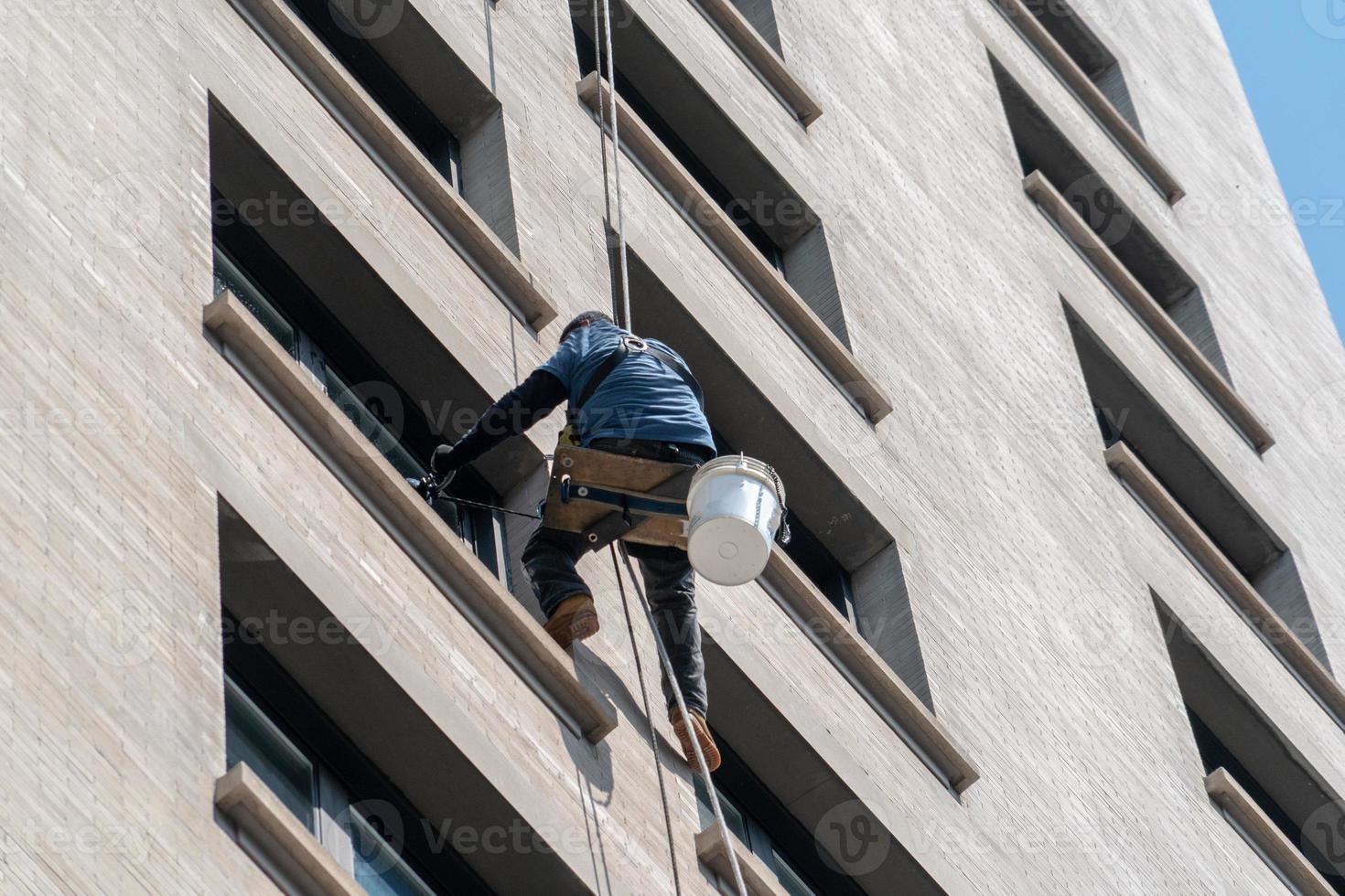 Window cleaners climbing skyscraper in New York photo