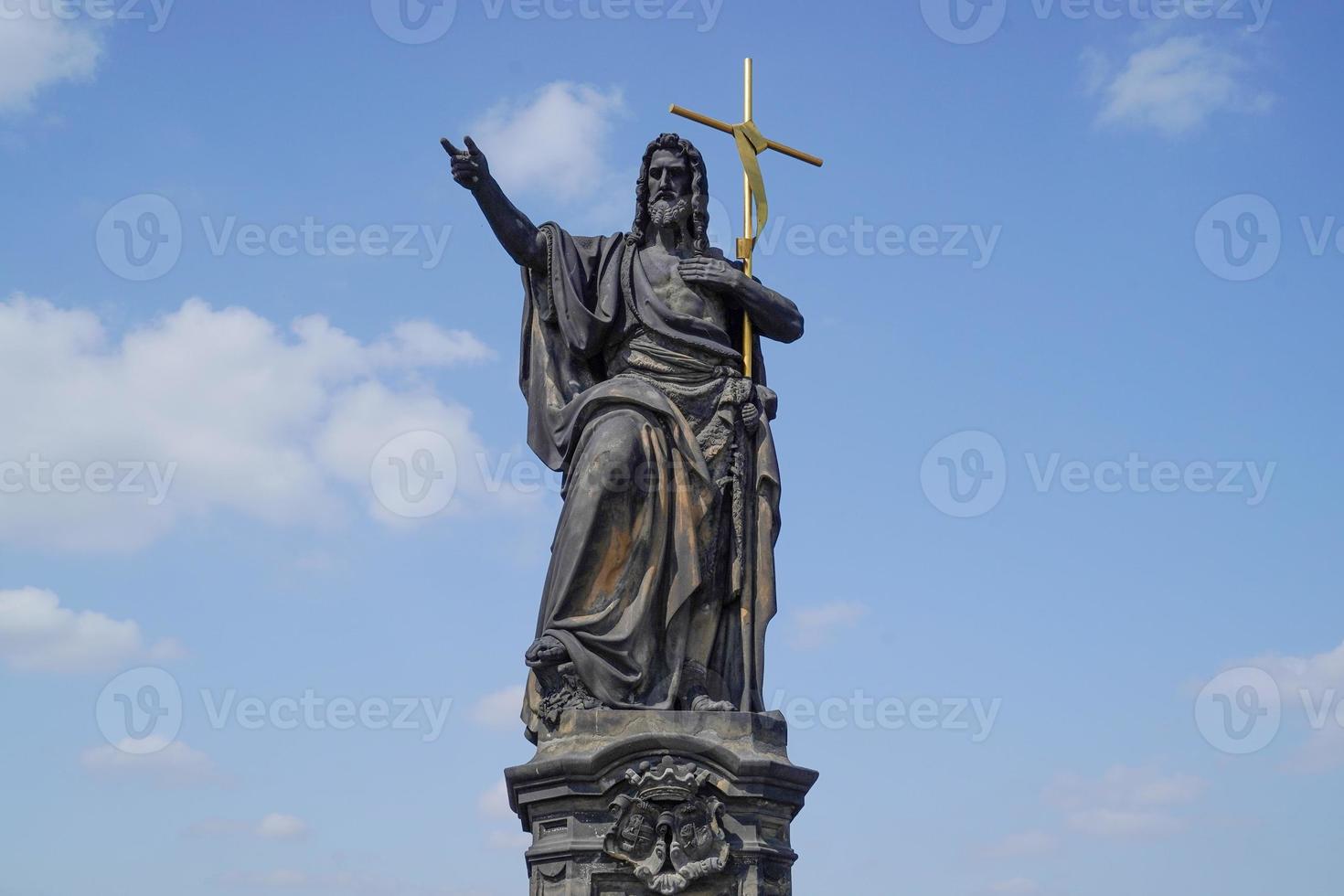 Prague charles bridge detail of statue photo