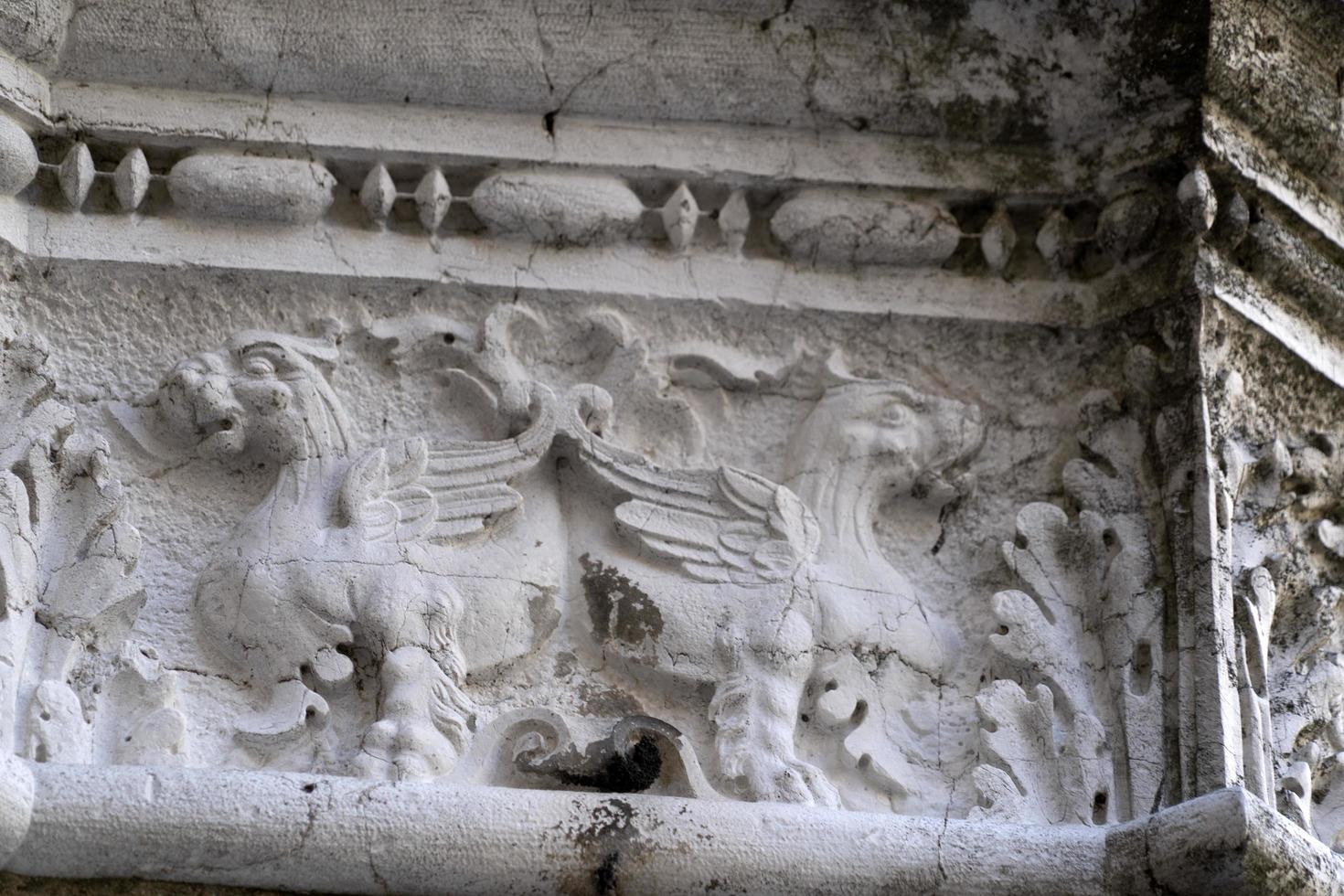 VENICE, ITALY - SEPTEMBER 15 2019 - doge ducal palace capital of column wayside sculpture detail photo
