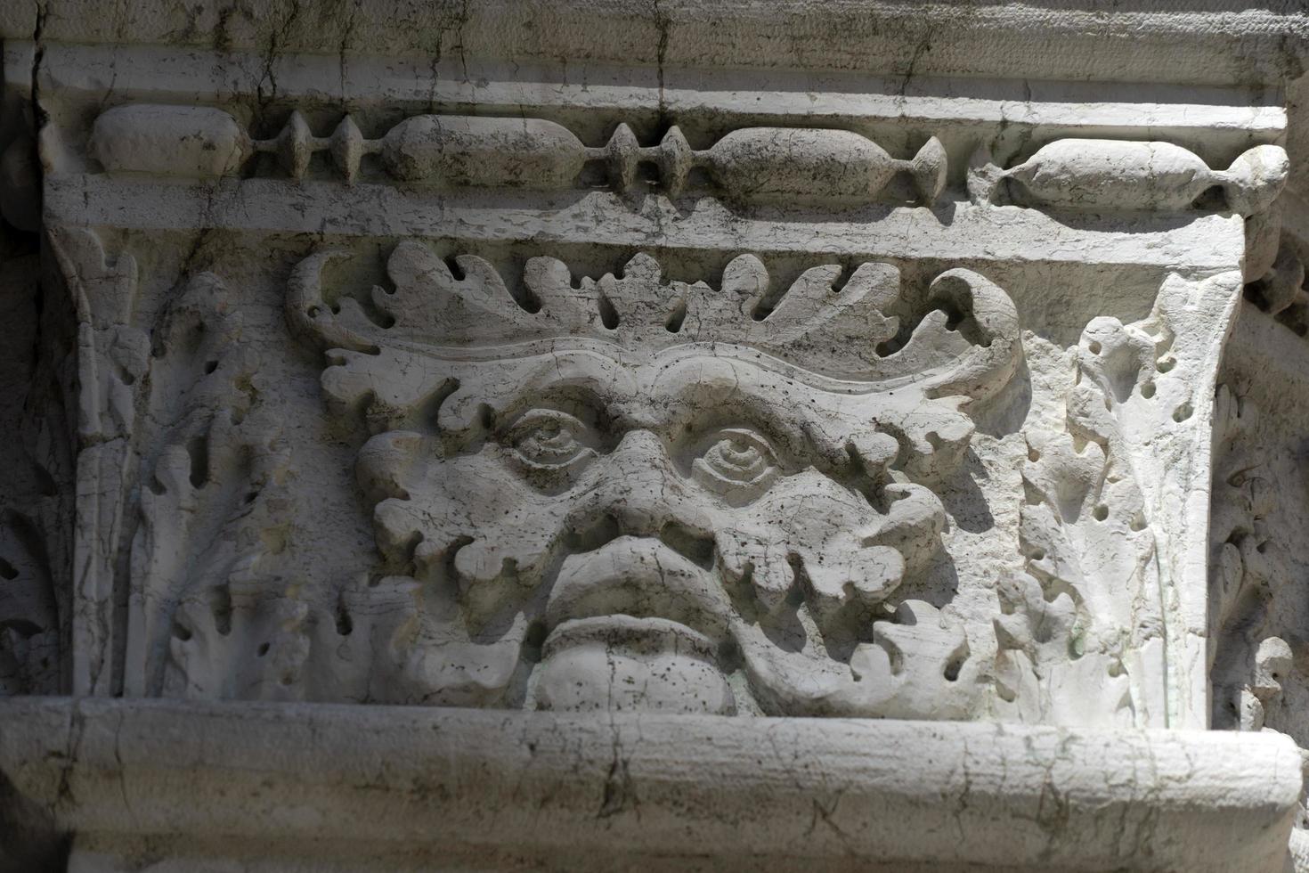 VENICE, ITALY - SEPTEMBER 15 2019 - doge ducal palace capital of column wayside sculpture detail photo