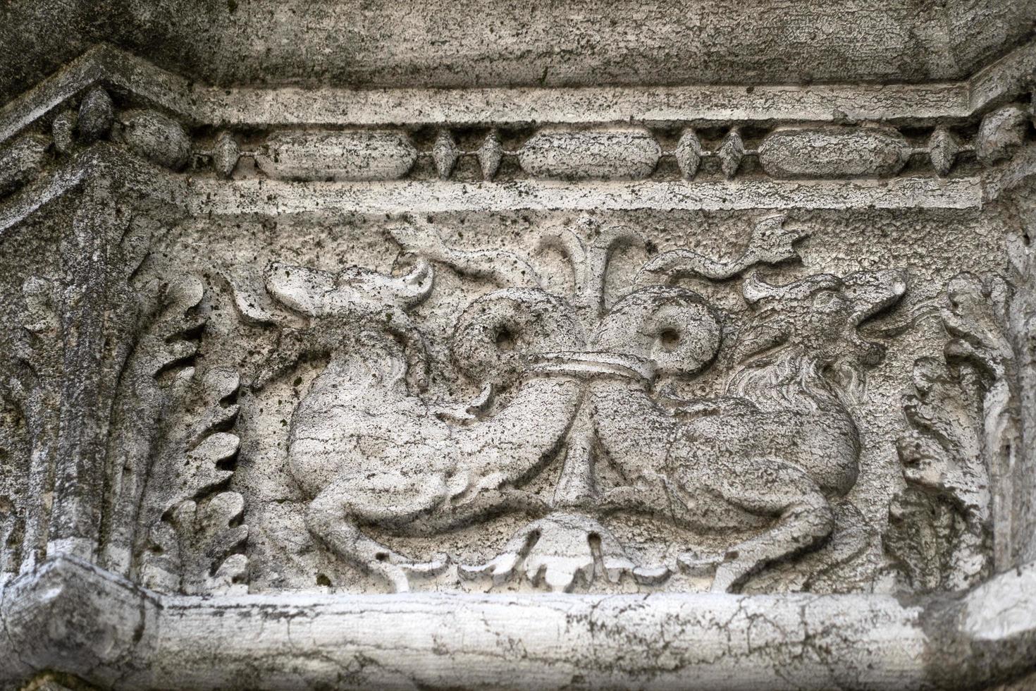 VENICE, ITALY - SEPTEMBER 15 2019 - doge ducal palace capital of column wayside sculpture detail photo