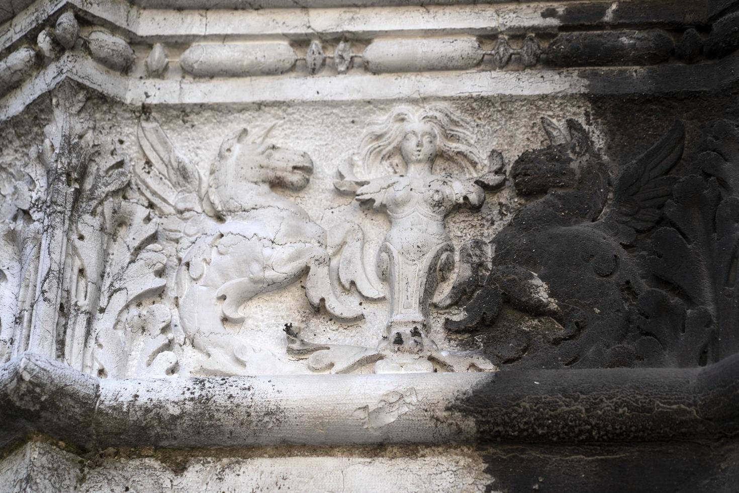 VENICE, ITALY - SEPTEMBER 15 2019 - doge ducal palace capital of column wayside sculpture detail photo