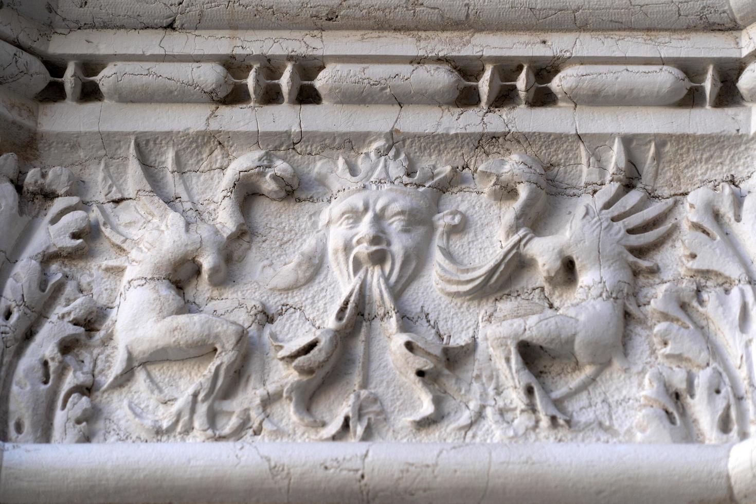 VENICE, ITALY - SEPTEMBER 15 2019 - doge ducal palace capital of column wayside sculpture detail photo