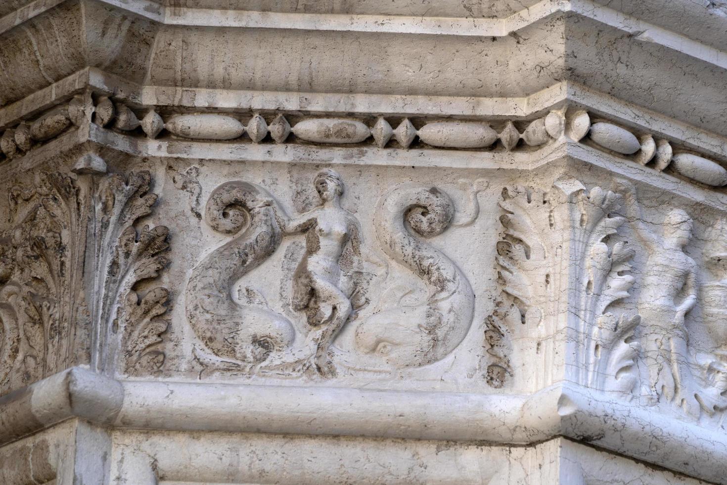 VENICE, ITALY - SEPTEMBER 15 2019 - doge ducal palace capital of column wayside sculpture detail photo