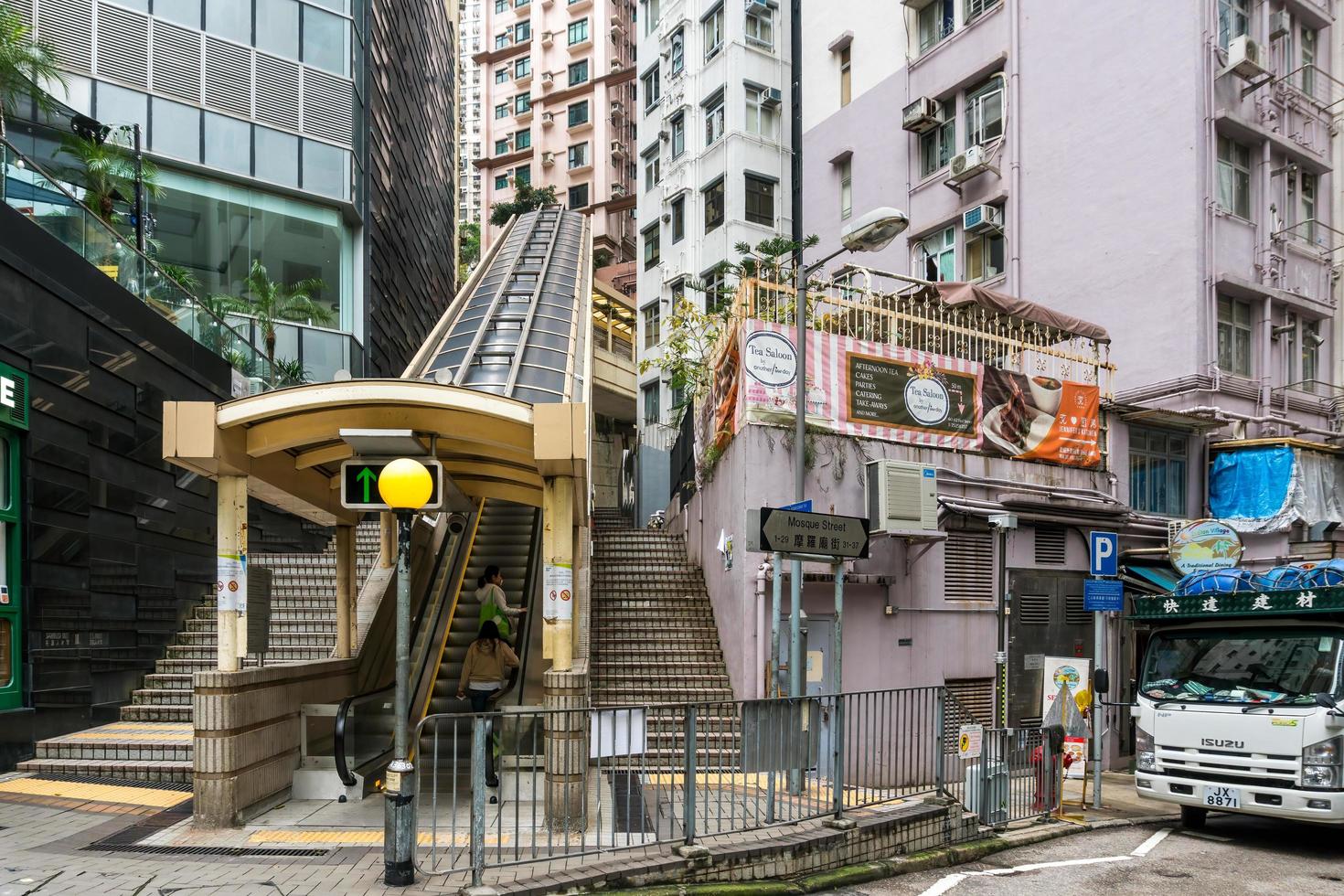 Hong Kong,March 25,2019-people among the skyscrapers through the streets of Hong Kong during a cloudy day photo