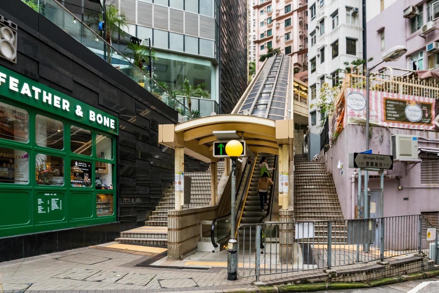 Hong Kong,March 25,2019-people among the skyscrapers through the streets of Hong Kong during a cloudy day photo